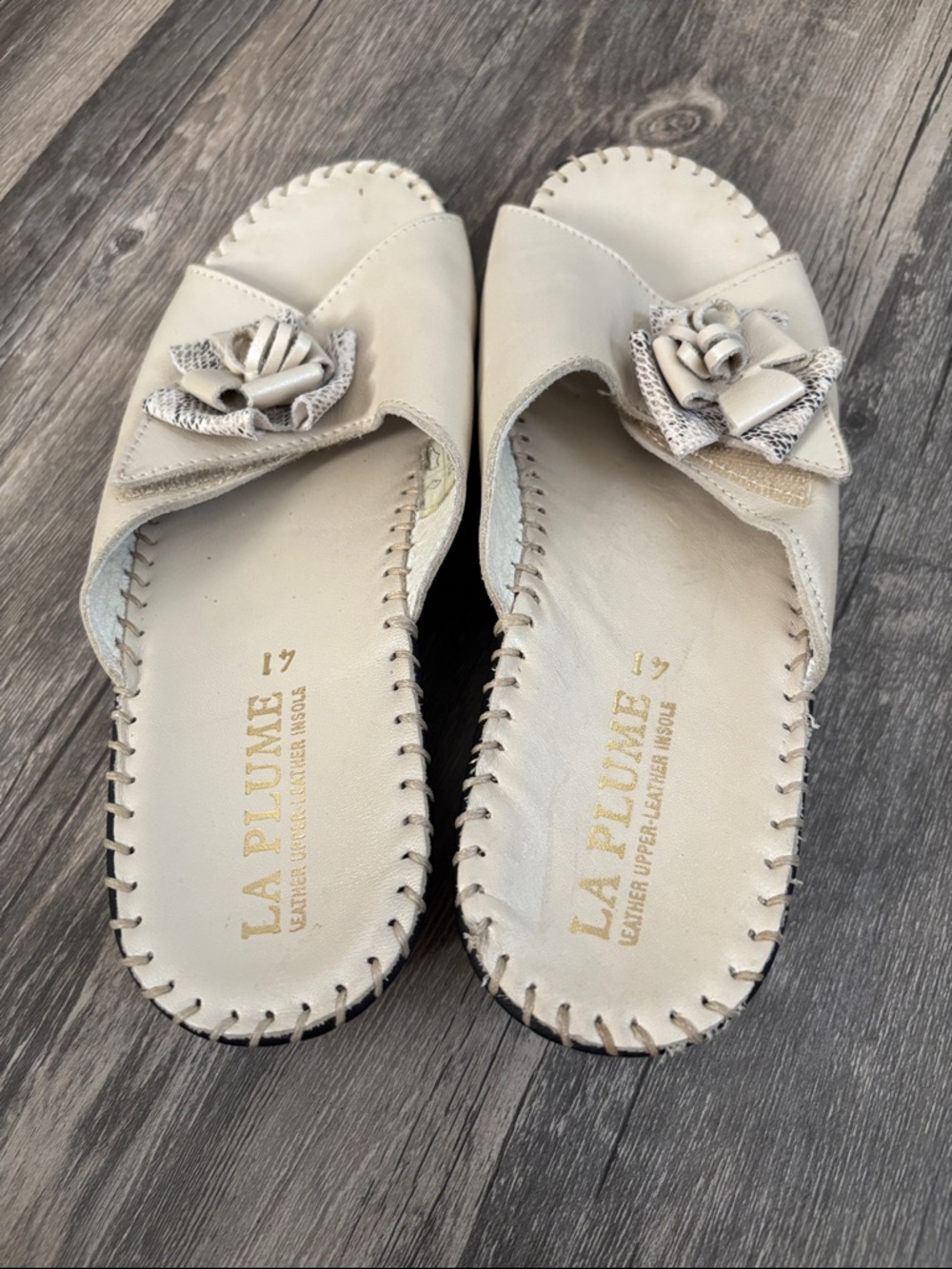 La Plume Cream Leather Slip-On Mules with Floral Accent
